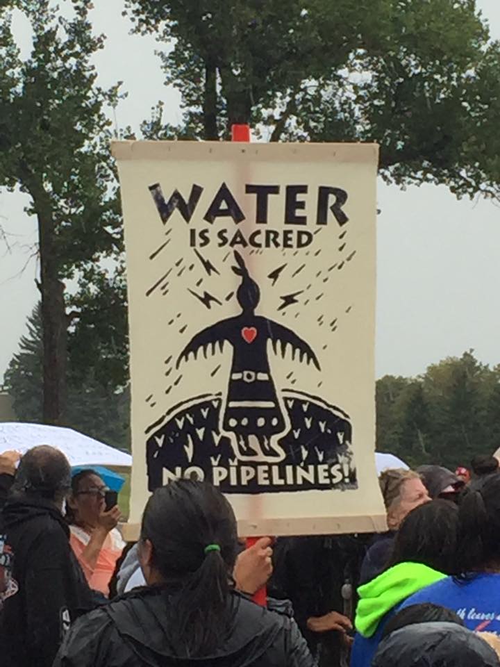 Water is Sacred sign. No Pipelines. A sign shown at the gathering at the state capital in Bismarck, N.D.