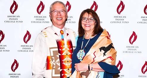 Dr. Cheryl Crazy Bull and Dr. David Yarlott pose for a photo at an American Indian College Fund event.