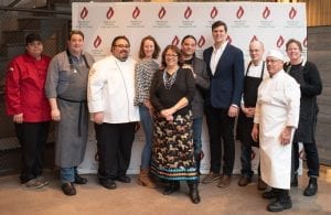 Professional chefs pose at fundraising culinary event for American Indian College Fund.