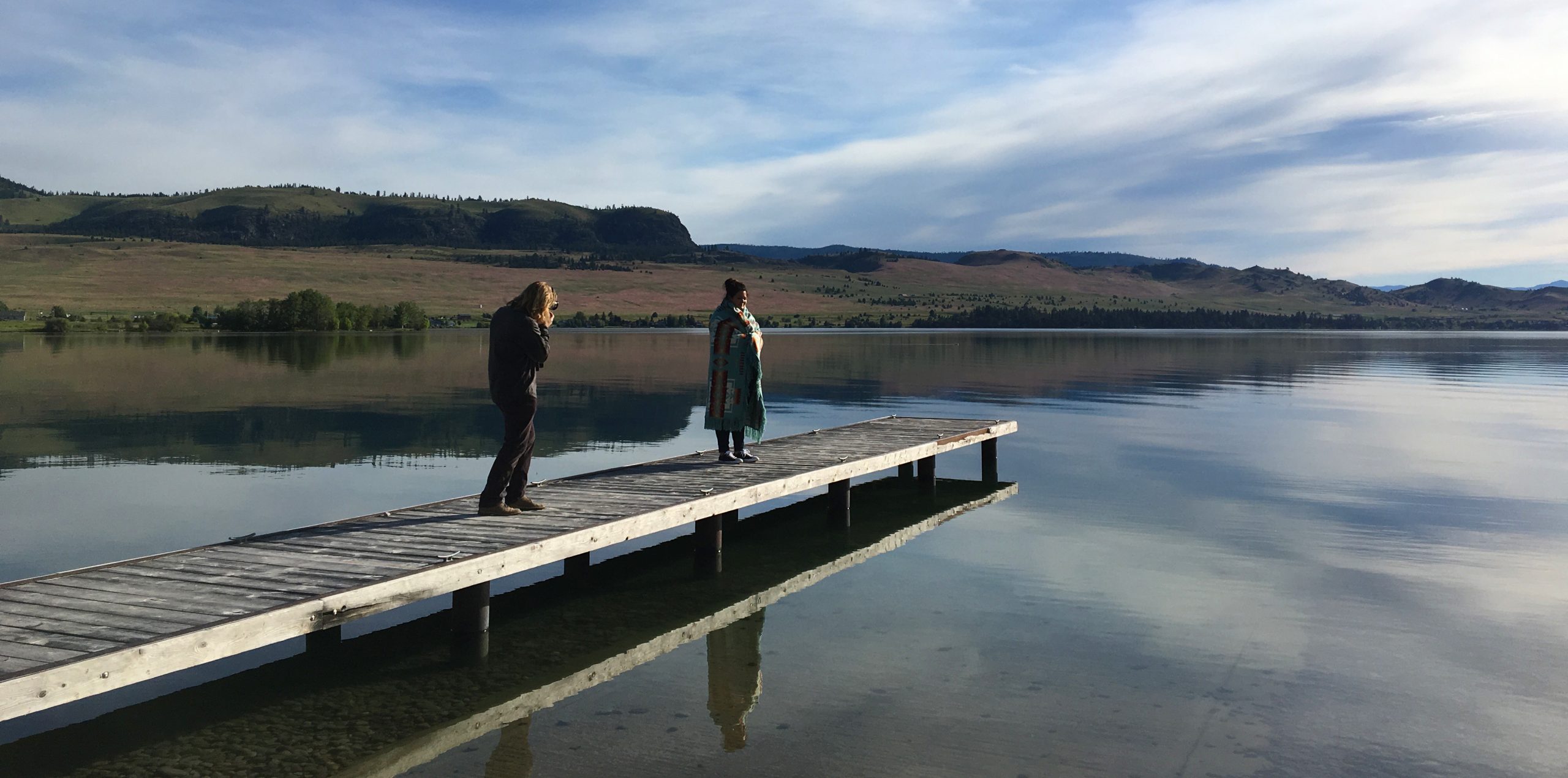 A College Fund photo shoot on location for the campaign by a lake on a dock.