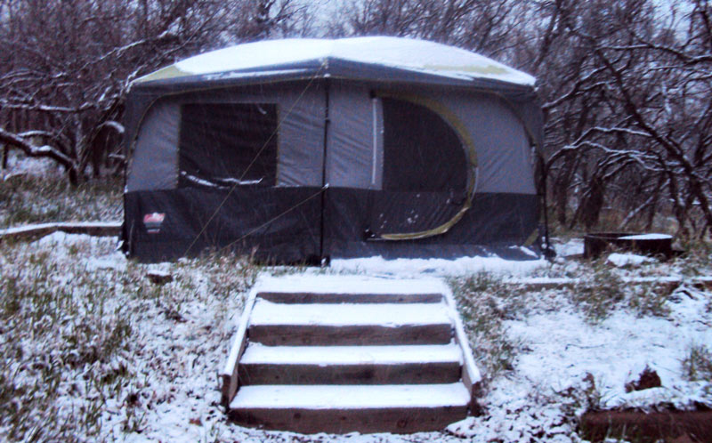 Camping tent gets hit with snow.