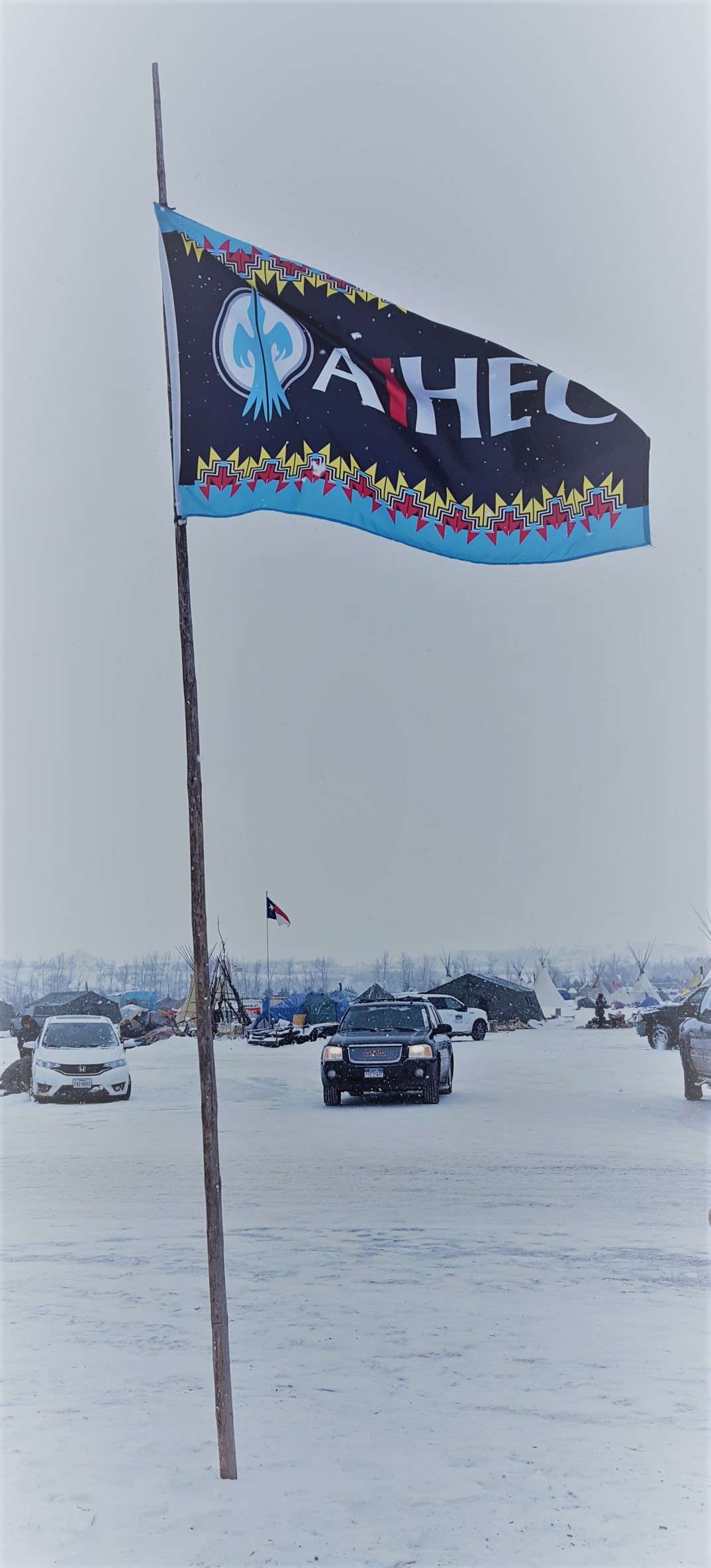 The AIHEC flag flies at the Sacred Stones Camp near Cannonball, N.D.