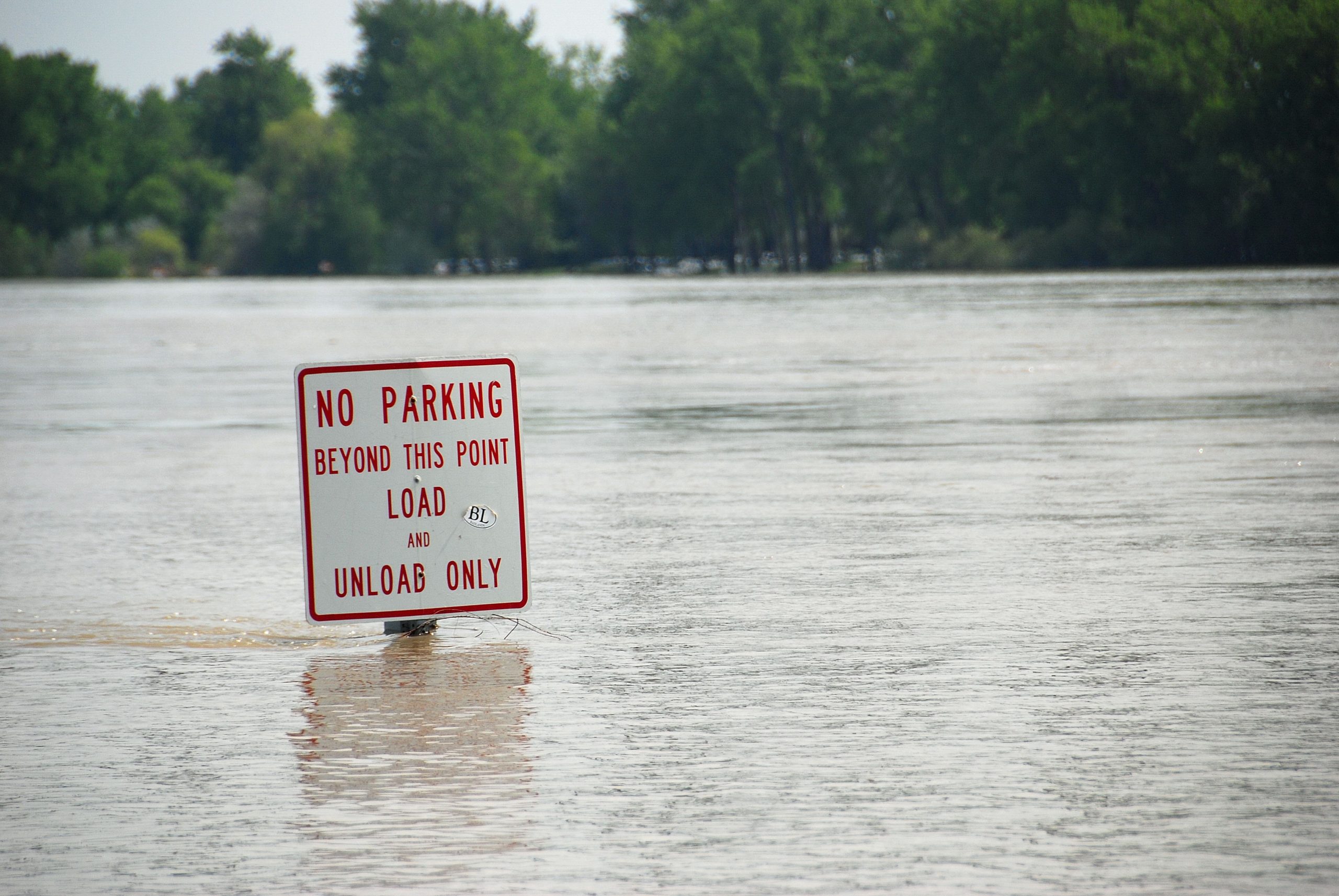 The Flooding reaches the top of street signs.