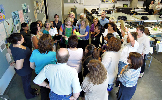 The cohort gets together to have an art critique.