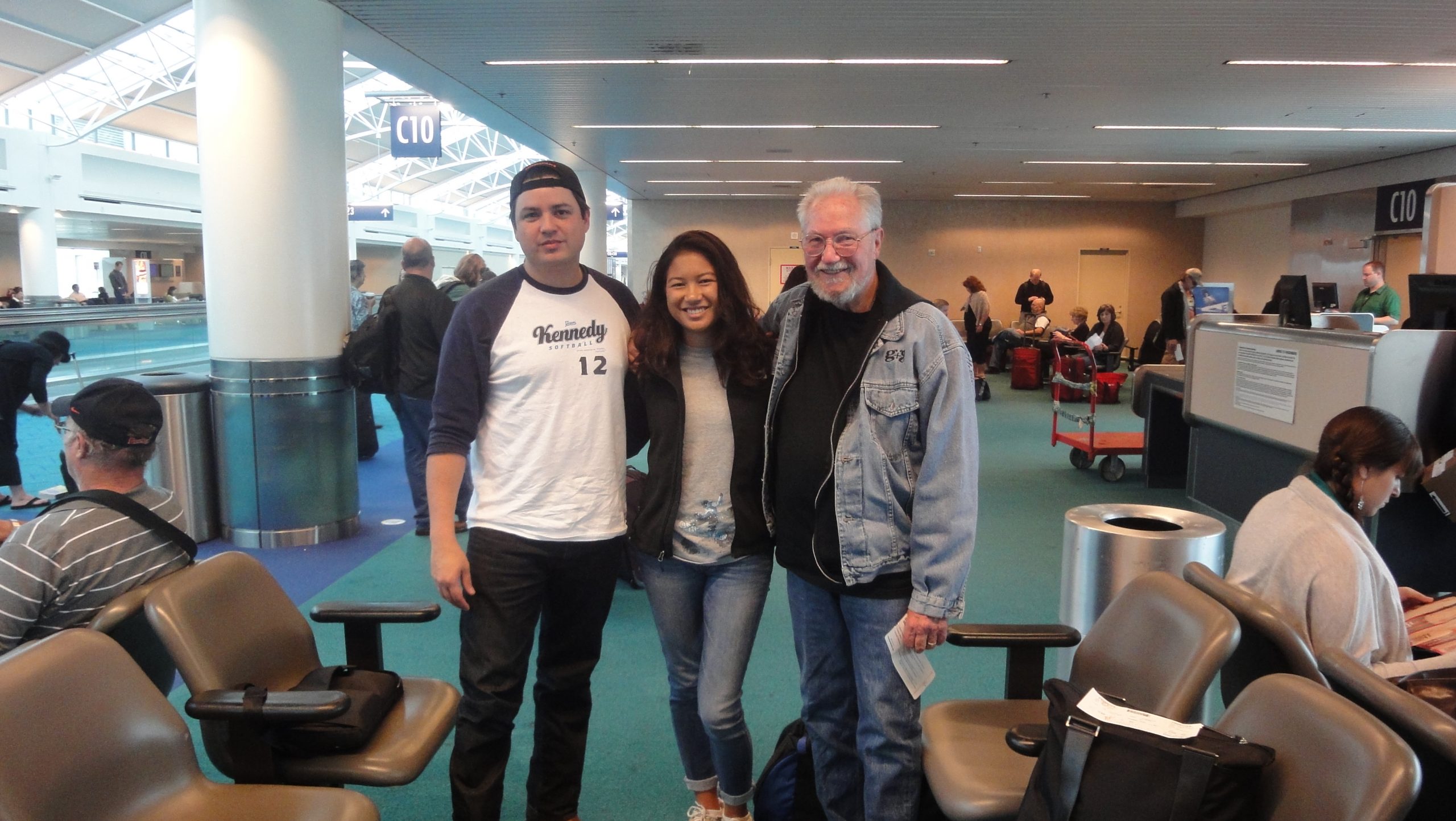 David Kennedy and Jonas Green with a student at the airport. 