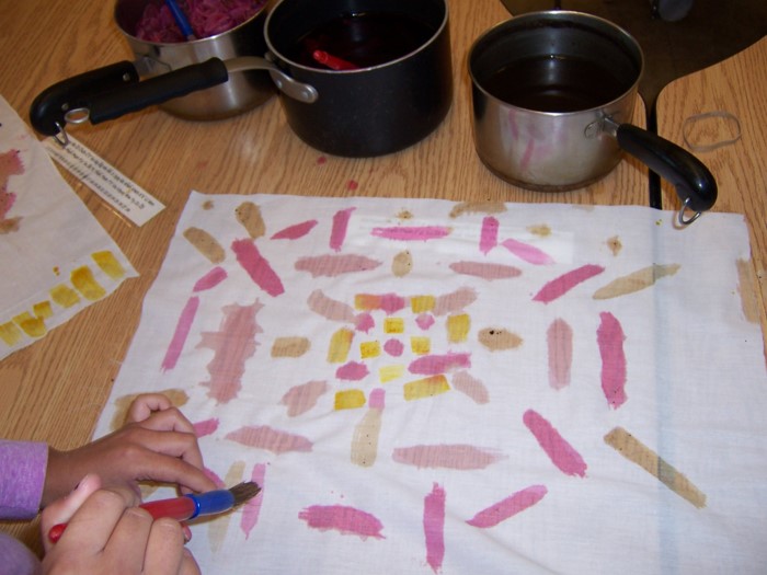 SBC Lakȟól’iyapi Wahóȟpi (Lakota Language Nest) children painted on muslin with their colored dyes.
