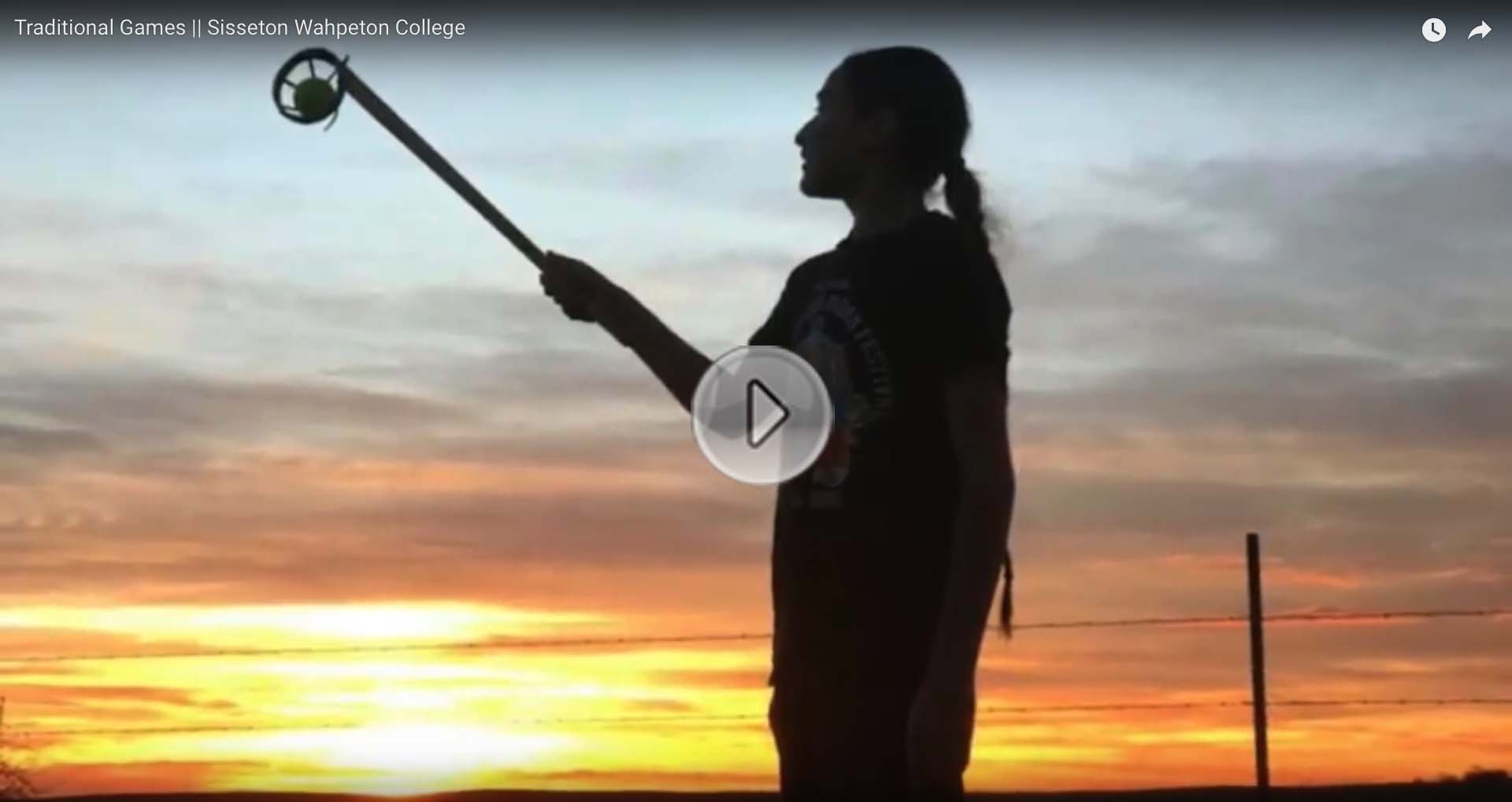 Image of person against a sunset with a link to click to see the Traditional Games (Ehanna Woyute) Film produced by Sisseton Wahpeton College Students on Traditional Dakota Games.