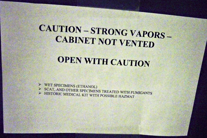 A sign warning of specimens. 