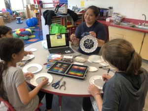 LaVonne Bellanger, pre-service teacher in the Anishinaabe Seasonal Science Course, teaching a lesson to children on dream catchers.