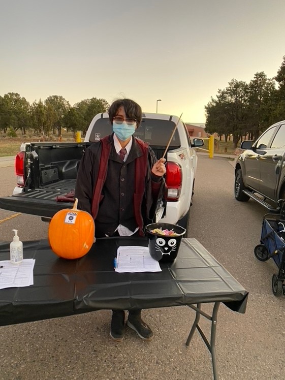 Diné College Trunk or Treat parking lot event. Harley Interpreter created a voter registration stand and distributed candy.