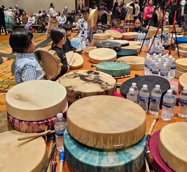 Little ones are soaking up the opportunity to learn from the Round Dance drum groups.