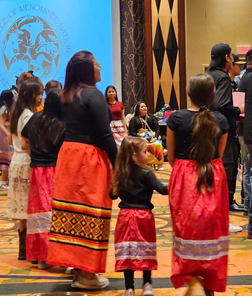 Red ribbon skirts, it's a family affair.