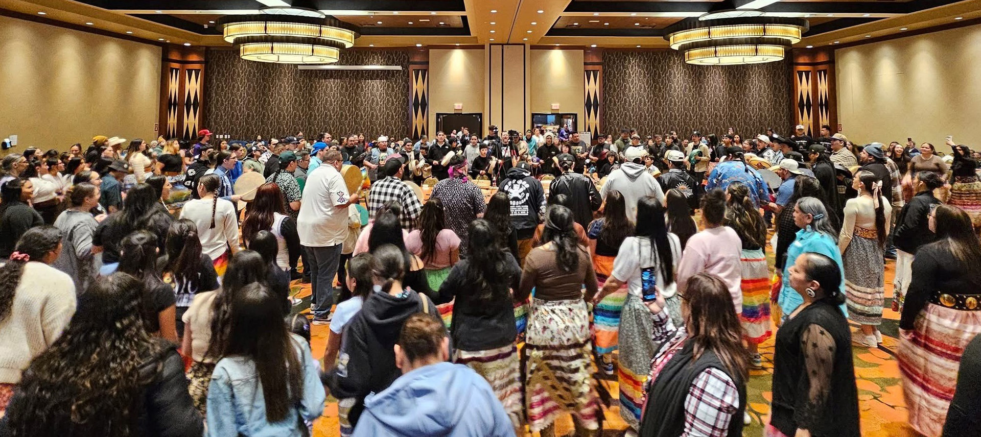 Faculty, staff, students and community members enjoy College of Menominee Nation's Honoring Indigenous Education Round Dance.