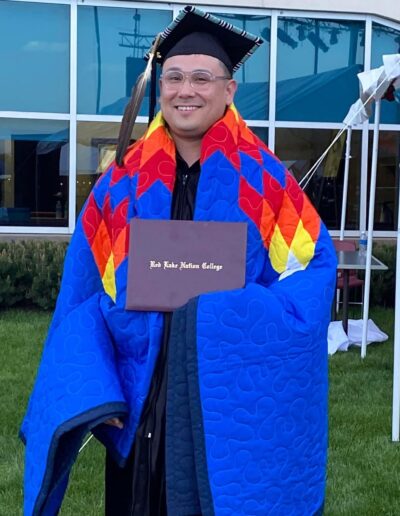 Justin Native student graduation regalia