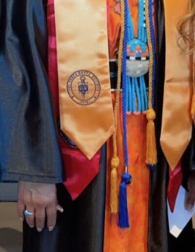 Rachel Native student graduation regalia