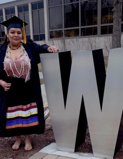 Terri Native student graduation regalia