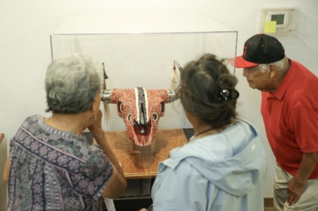 Members of the Northern Cheyenne Nation visit a display of Senator Ben Nighthorse Campbell’s artwork at Chief Dull Knife College.