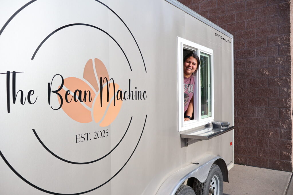 SKC HSE graduate and entrepreneur, Mataya Oakland, stands outside her mobile coffee shop.