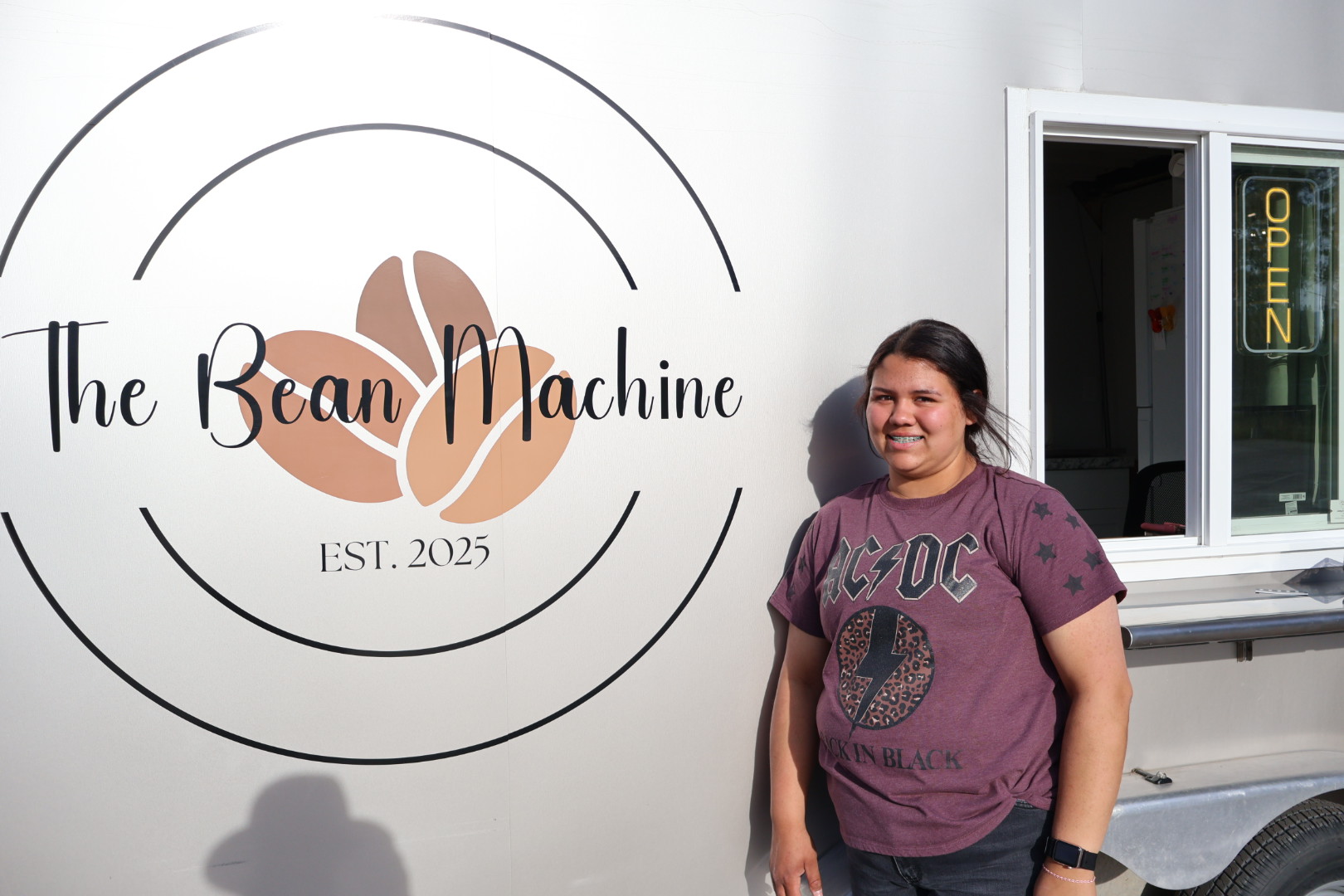 SKC HSE graduate and entrepreneur, Mataya Oakland, stands outside her mobile coffee shop.