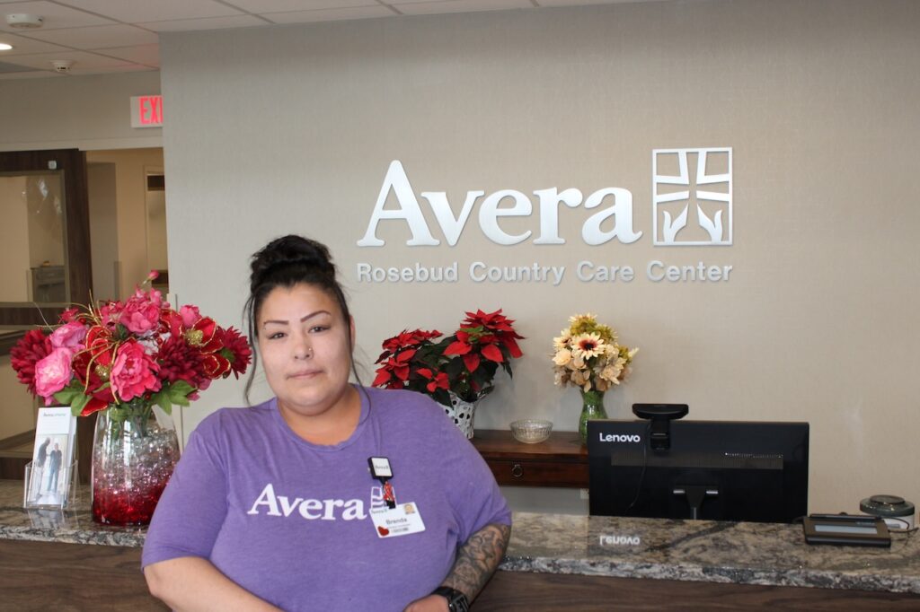 Brenda at her place of employment, where she recently received a promotion after obtaining her GED